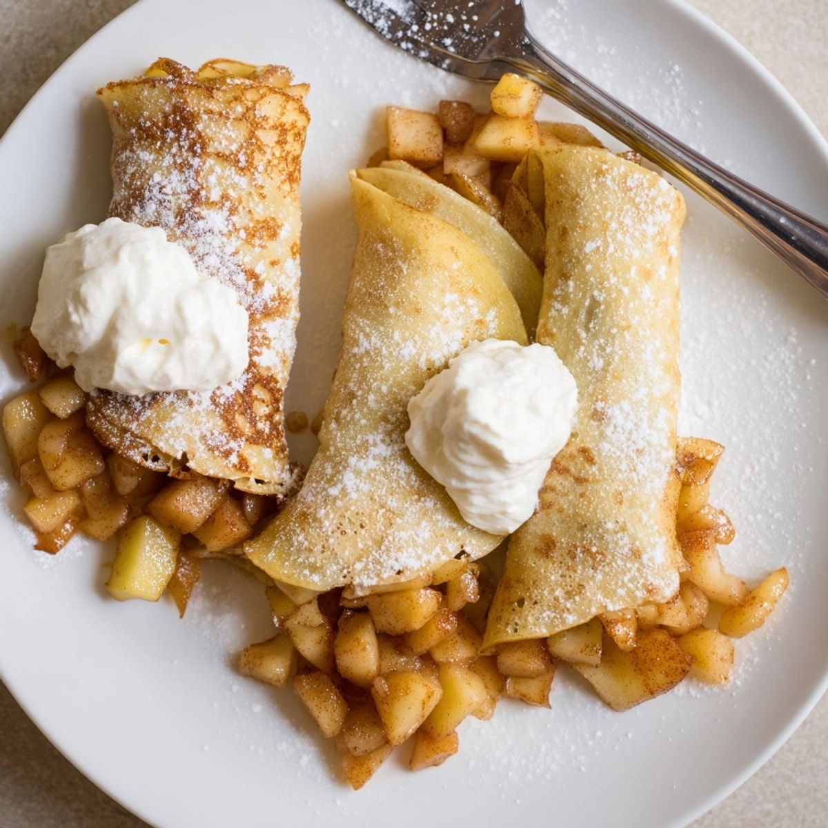 Delicate Mini Apple Nalesniki, a tantalizing sweet crepes, filled with warm cinnamon spiced apples.