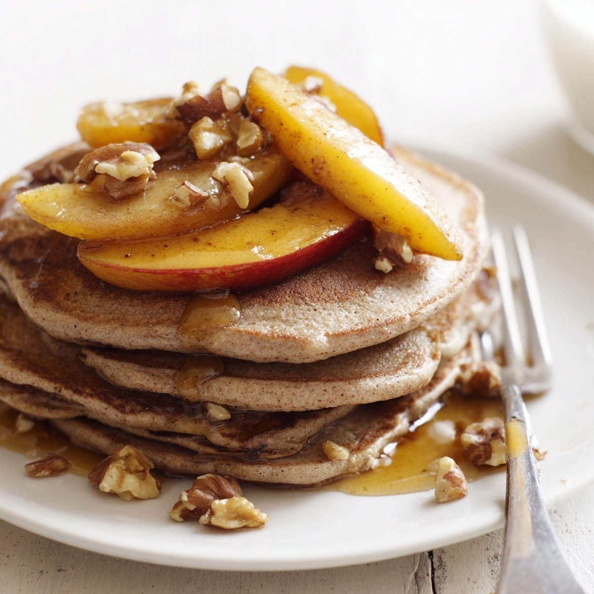 Buckwheat pancakes with roasted apple: golden, fluffy, and ready for a cozy brunch.