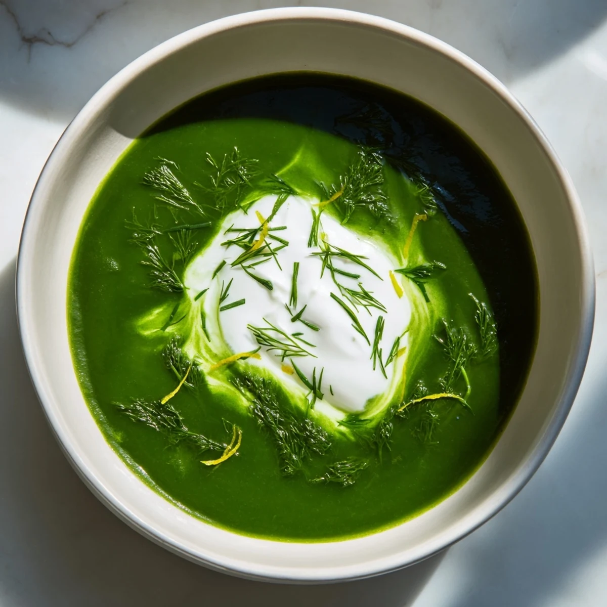 Creamy Viral Nettle Soup Twist, a vibrant green soup, garnished and served with a lemon wedge.