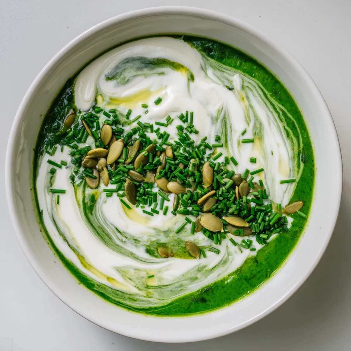 Creamy and earthy Viral Nettle Soup Twist, garnished with fresh chives, ready to eat.