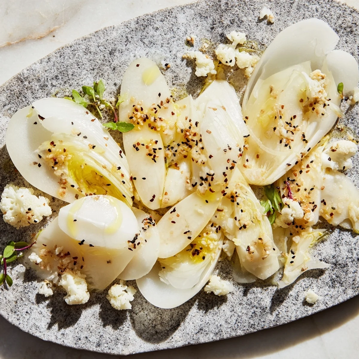 Crisp, cold vegetables artfully arranged as The Tundra Trek, perfect for a light vegetarian meal.