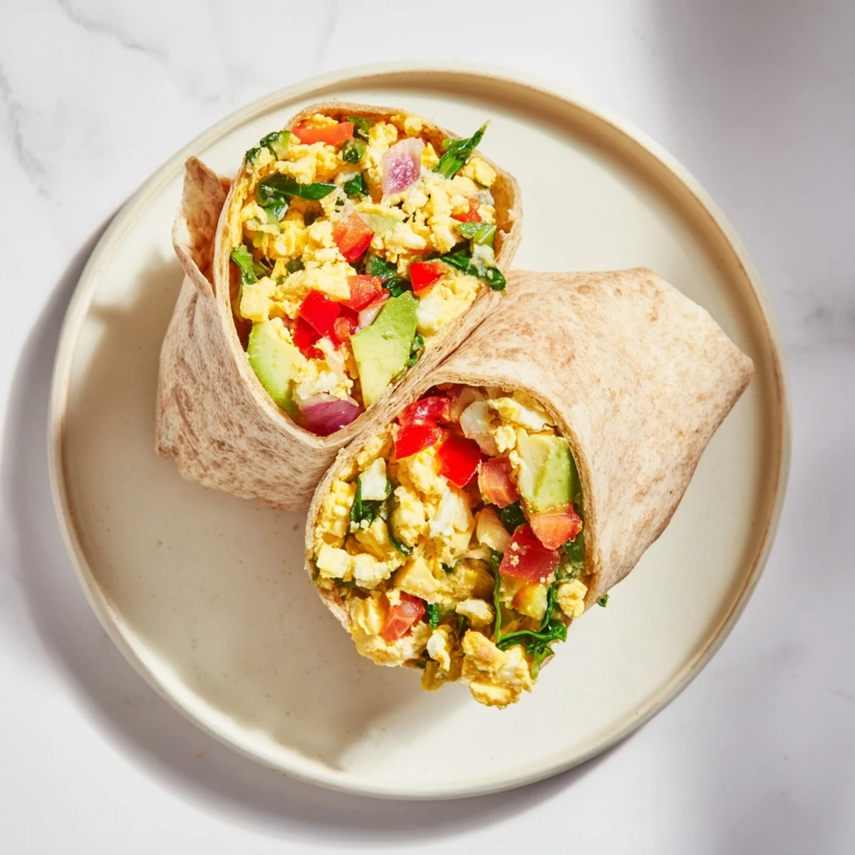 Freshly assembled Veggie-Loaded Breakfast Burrito, a perfect hand-held breakfast wrap, ready to enjoy.
