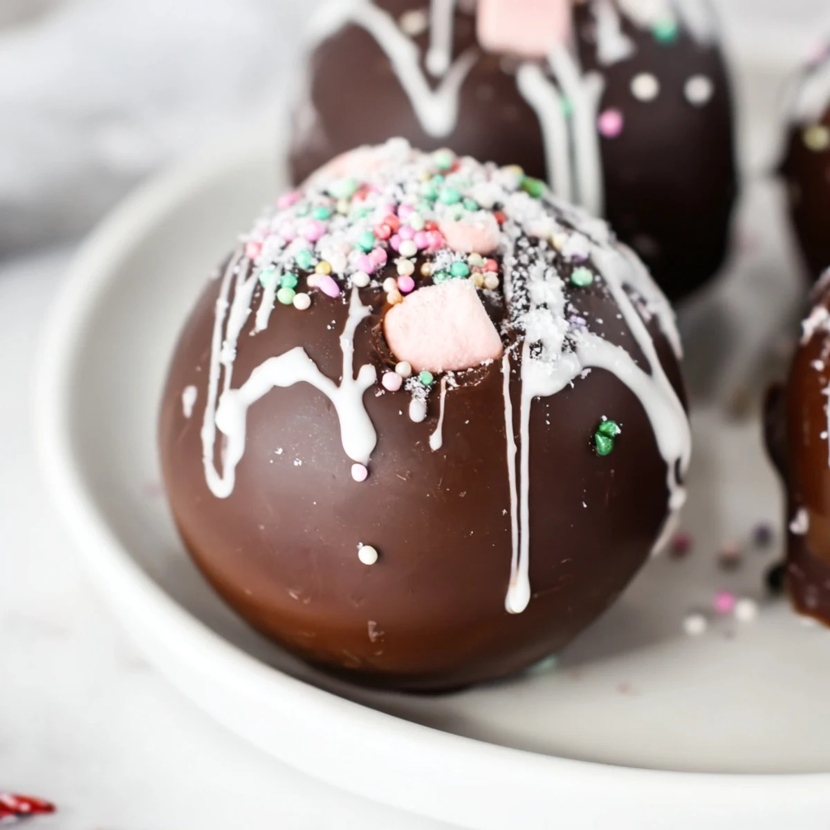 Rich, decadent hot chocolate bombs, melting into creamy hot chocolate with marshmallows.