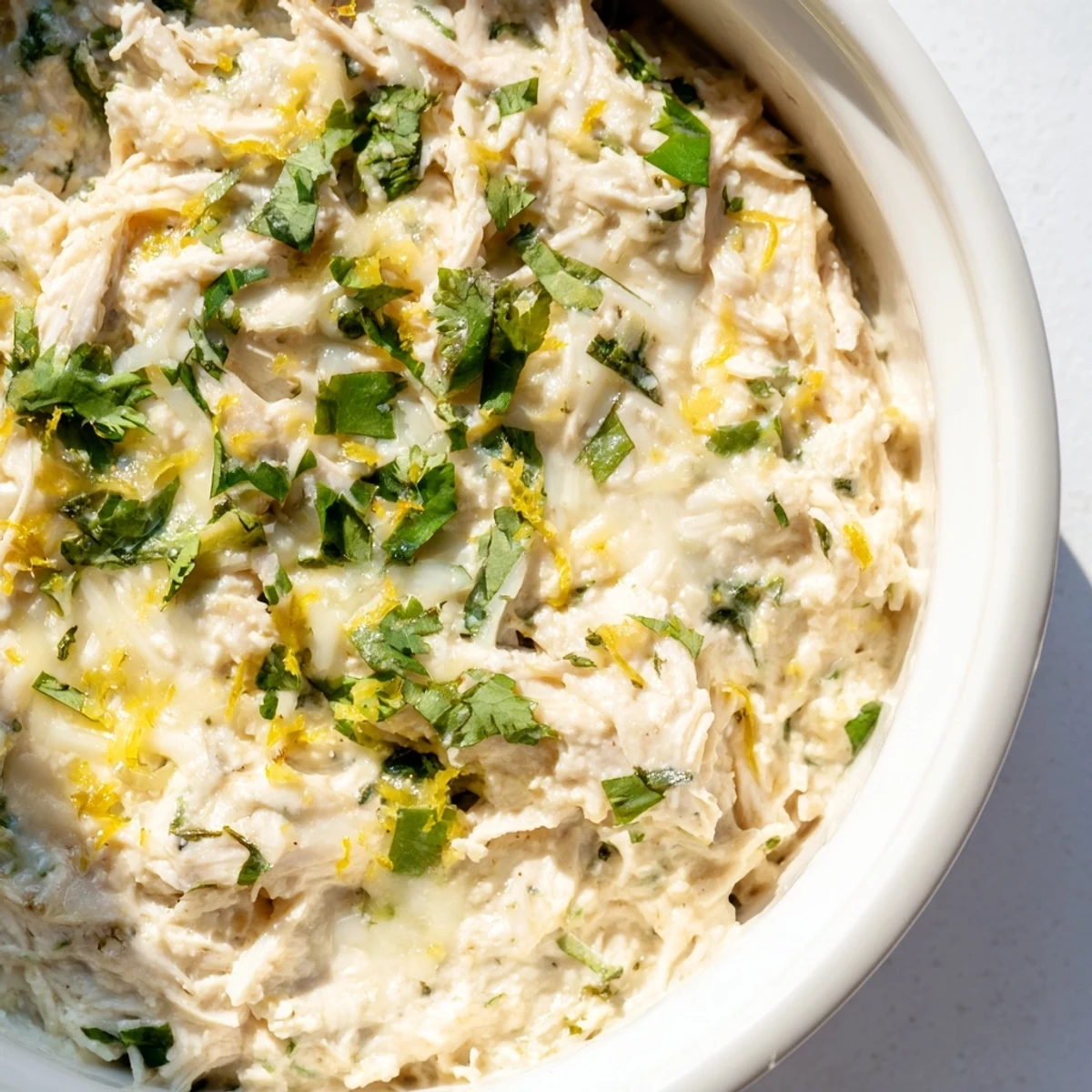Creamy, baked Cilantro and Lime Chicken With Scoops with golden cheese topping and tortilla chips.