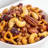 Sweet and Salty Holiday Nut Bowl with golden, roasted nuts and crunchy pretzels.