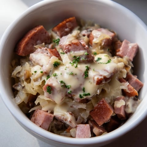 Miniature Bigos Polowy with silky sauce, a hearty Polish stew, beautifully presented in a small bowl.