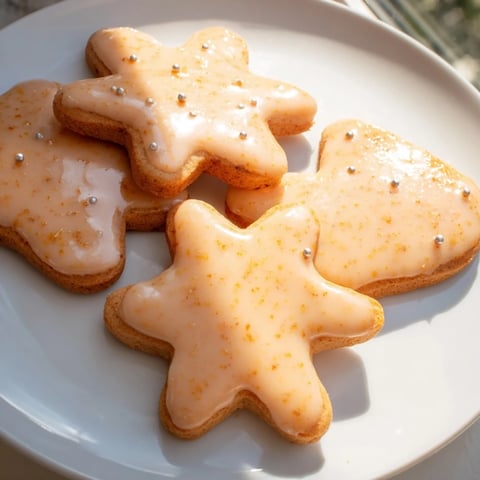 Traditional Polish Pierniki, freshly baked gingerbread cookies with golden edges and festive icing.