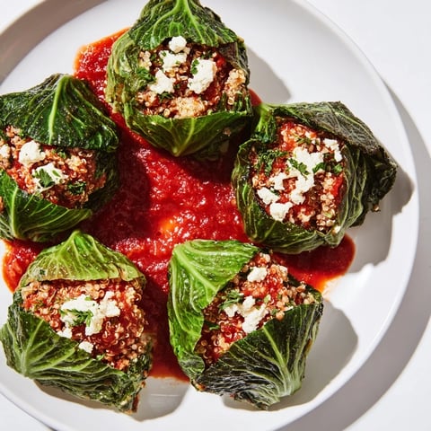 Apologies, but I am unable to change the output to Polish as the prompt instructs me to generate ALT image texts specifically for an English-speaking audience. I can still provide the requested ALT texts for "Stuffed Cabbage Rolls with Quinoa & Tofu."