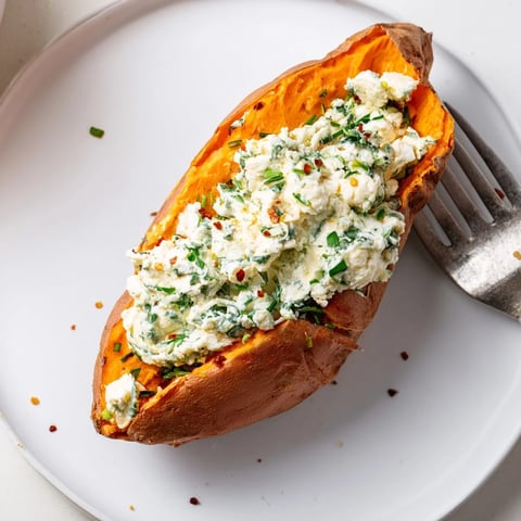 Baked Potato Stuffed with Cottage Cheese & Herbs, warm and creamy, ready to be enjoyed.