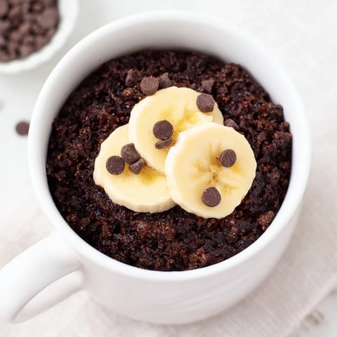 Rich, chocolatey Chocolate Banana Mug Cake, warm and fluffy, ready for a dessert craving.