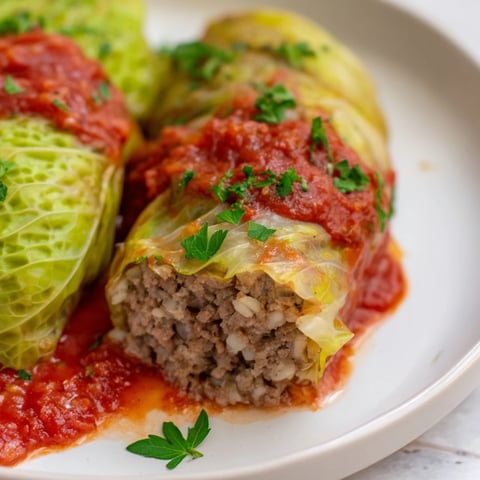 Simple Gołąbki bathed in tomato sauce, a classic Polish comfort food.