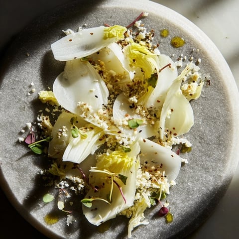 The Tundra Trek: a chilled artistic appetizer with delicate vegetables and sesame seeds.