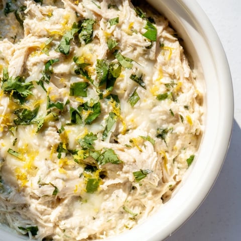 Creamy, baked Cilantro and Lime Chicken With Scoops with golden cheese topping and tortilla chips.