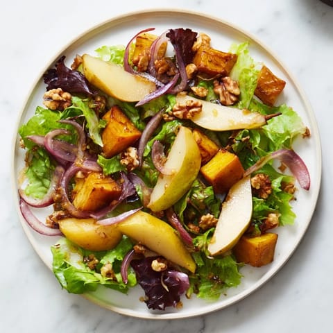Vibrant image of oven-roasted parsnip and pear salad, offering sweet and savory flavors.