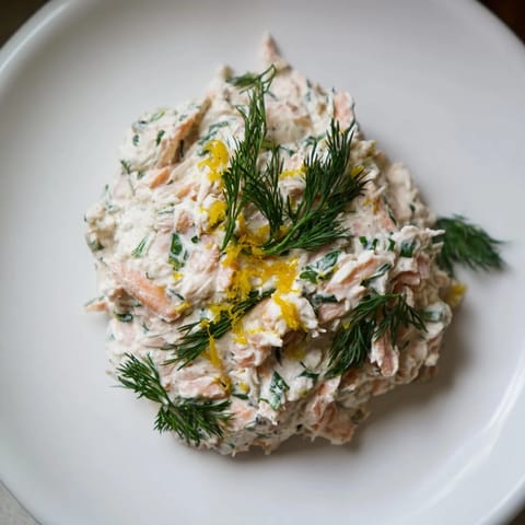 Flaked salmon and fresh dill blend beautifully in this creamy Dill & Horseradish Salmon Spread, a delectable dip.