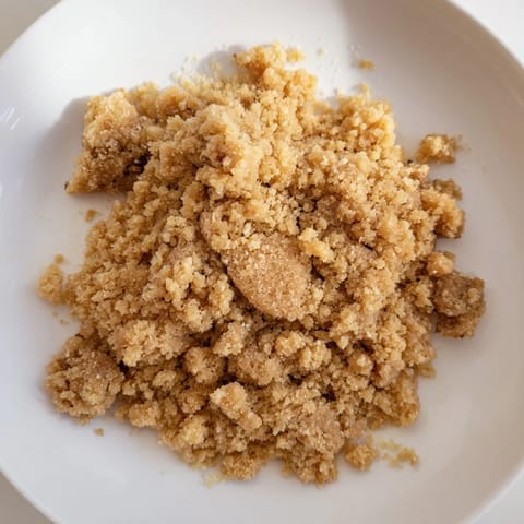 Coarse, crumbly texture of homemade Quick Makowiec topping, perfect for traditional Polish desserts.