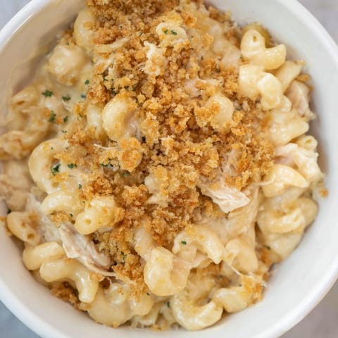 Creamy, homemade cheese sauce coats the tender Struggle Meal Chicken Macaroni with canned chicken.