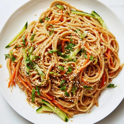 A bowl of delicious cold sesame noodles, featuring a rich, flavorful sesame sauce.