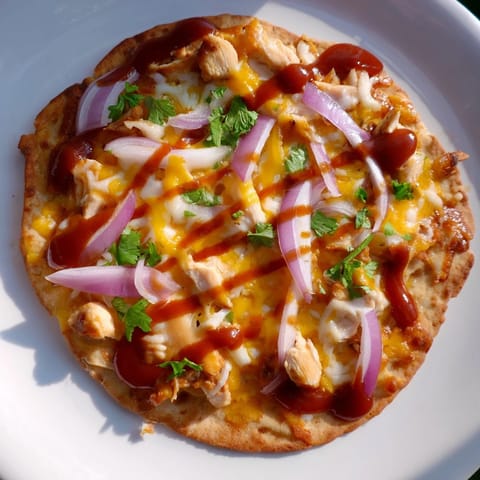 Golden, crispy BBQ Chicken Flatbread, topped with fresh cilantro, a quick and easy American favorite.