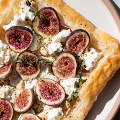 Golden-baked Puff Pastry Truffle Pizza, with honey-drizzled figs and creamy goat cheese, pictured perfectly.