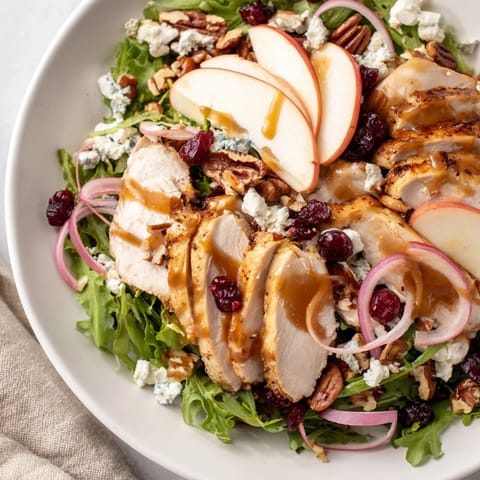 This Caramel Apple Chicken Salad features colorful ingredients and looks refreshing, ready to be enjoyed.