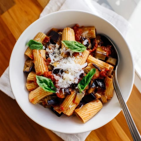 Rigatoni tossed in a rich, chunky tomato sauce for the classic Pasta Alla Norma.