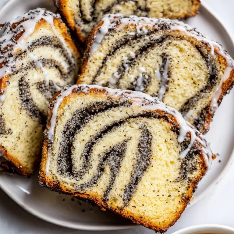 Delicious Rebel Float Poppyseed Babka slices topped with a light glaze, perfect with coffee.