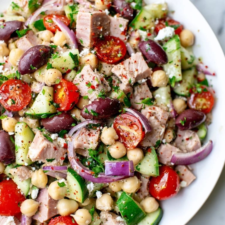Freshly assembled Tuna Chickpea Salad with tuna and chickpeas; ready to eat or meal prep.