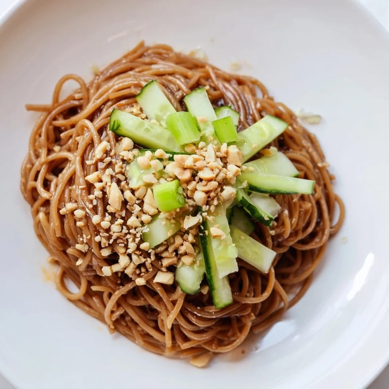 Fresh Spicy Sesame Noodle Salad with vibrant cucumber ribbons and fragrant cilantro, a quick meal.