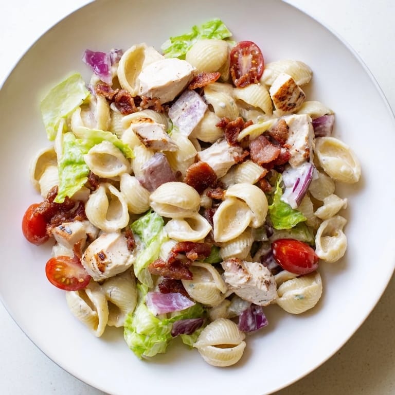 Creamy BLT Chicken Pasta Salad with grilled chicken and bacon, perfect for a picnic or quick lunch.