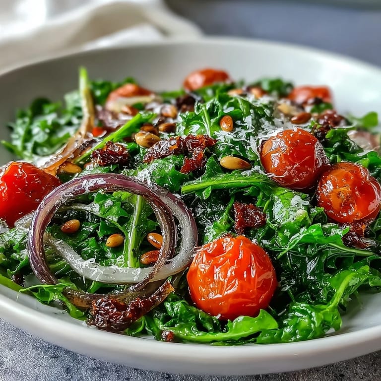 Bright dandelion greens salad tossed with lemon vinaigrette, cherry tomatoes, and Parmesan shavings for a crisp, zesty bite.  