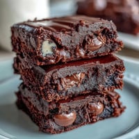 Cadbury Egg Chocolate Brownies with Crumbled Top: rich, fudgy chocolate brownies studded with Cadbury mini eggs and topped with a crunchy chocolate crumble.